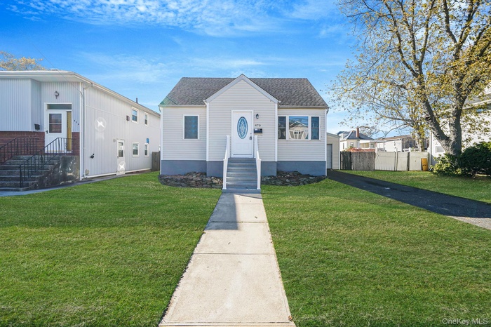 Bungalow-style home featuring a shingled roof