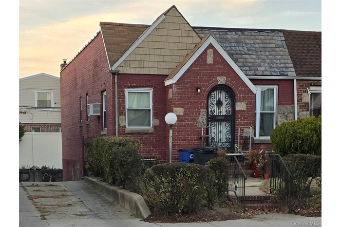 View of front of house featuring brick siding