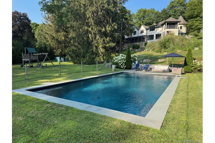 Beautiful 2 acres with a sparkling in ground pool