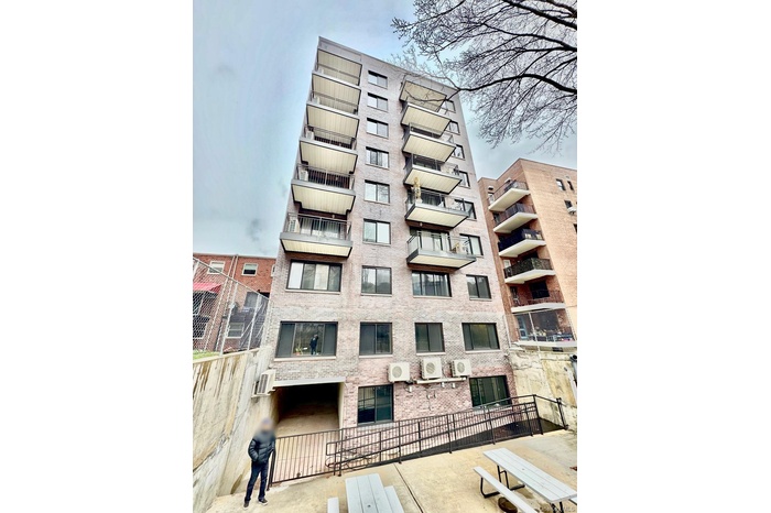 View of property featuring a wall mounted air conditioner