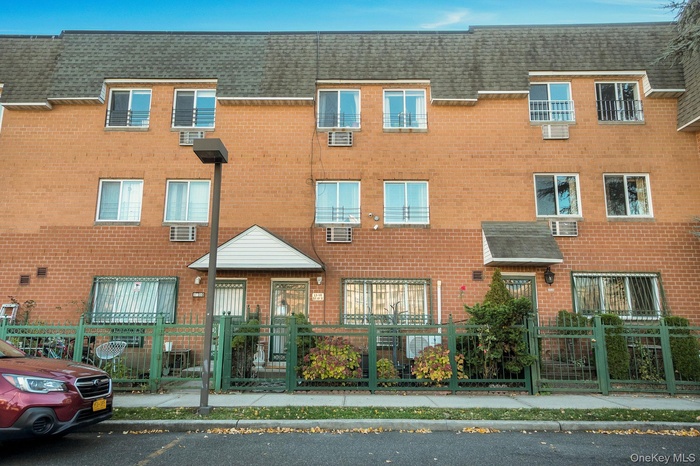 View of property featuring a fenced front yard