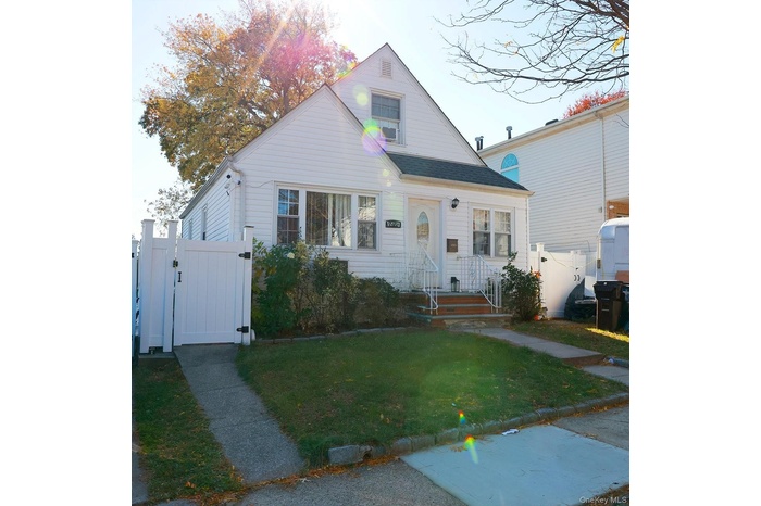 Bungalow-style house featuring a gate