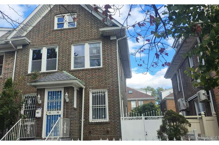 View of front of property featuring brick siding