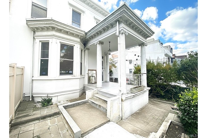 Property entrance featuring a patio area