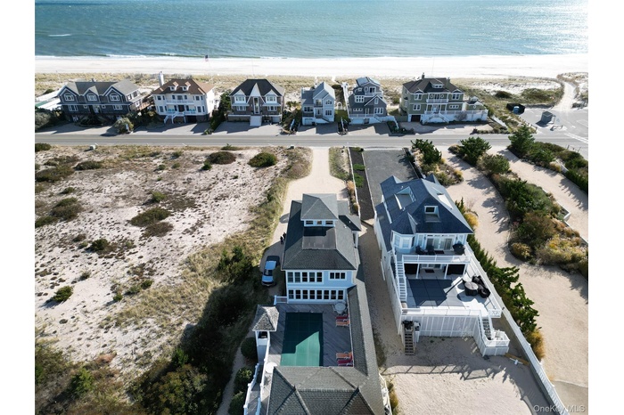 Aerial perspective of suburban area with unending shoreline