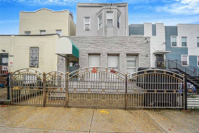 View of front of home with a gate and a fenced front yard