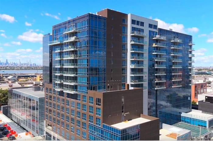View of apartment building / complex with a view of skyline