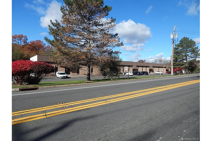 Front of the structure and parking lot.