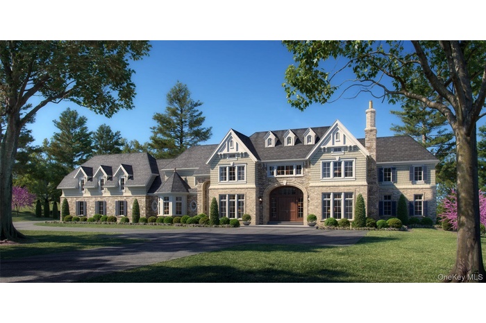 View of front of house with a chimney, a front lawn, and stone siding