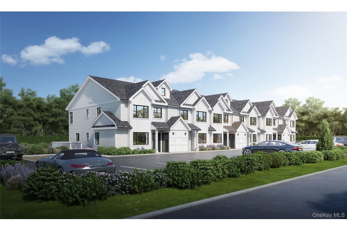 View of front of house featuring a shingled roof and uncovered parking