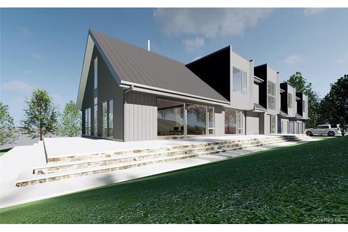 Back of house featuring a yard and a metal roof