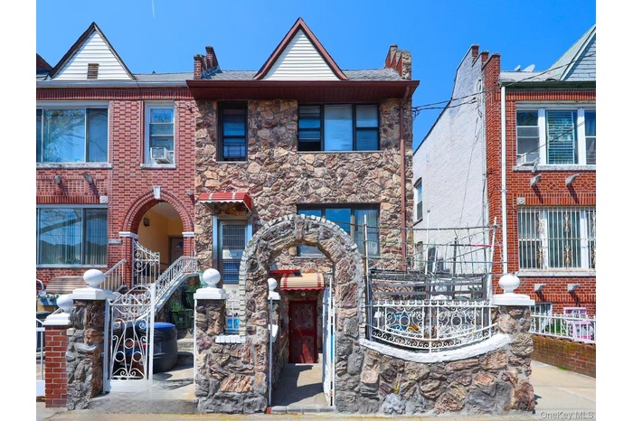 Townhome / multi-family property with stone siding