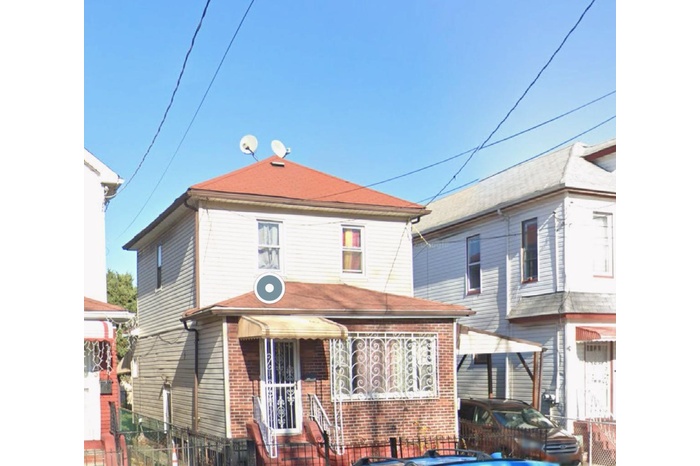 View of front of home with brick siding