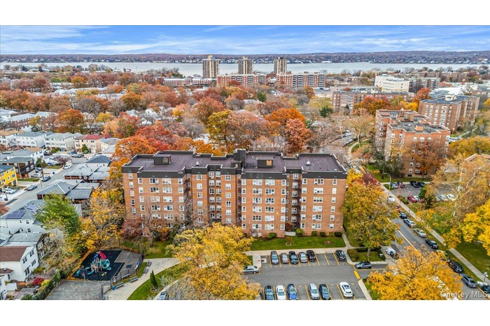 View of urban area featuring a nearby body of water and apartment complex / building
