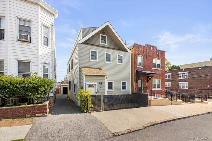 Traditional home featuring a fenced front yard