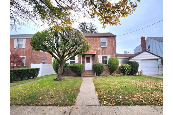 View of front facade featuring brick siding