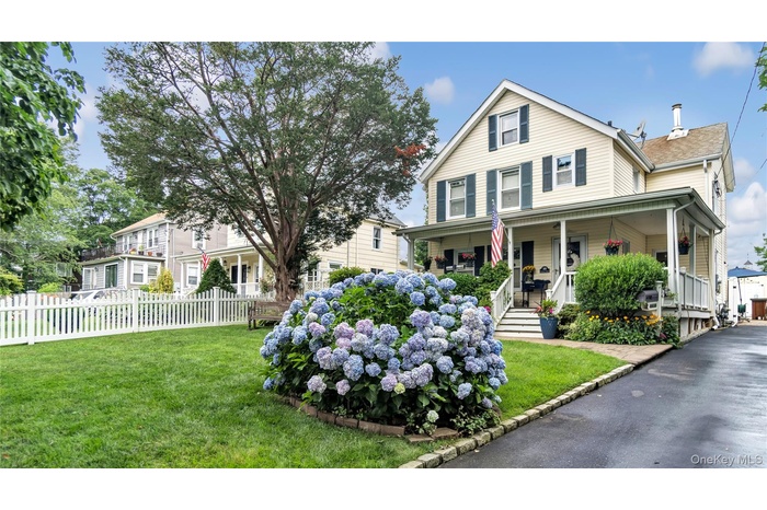 Country-style home featuring a porch