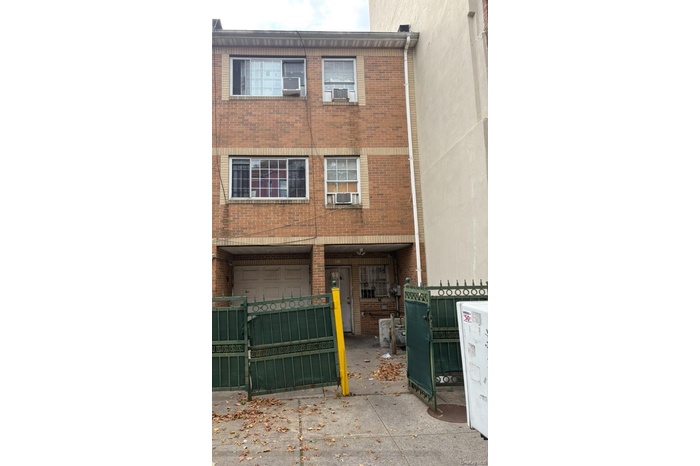 View of front of property featuring brick siding