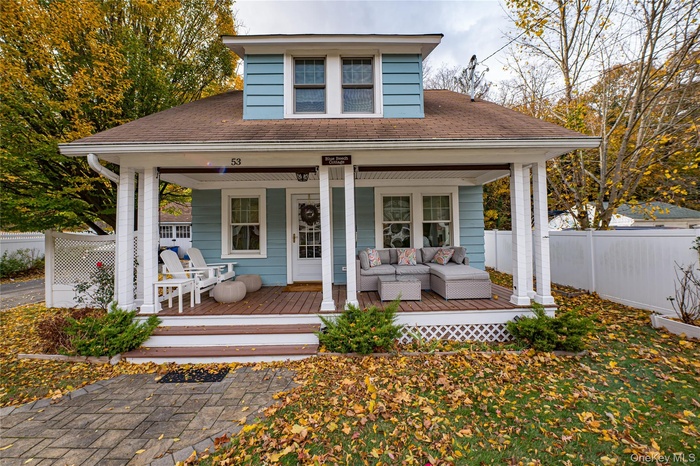 View of front facade featuring an outdoor hangout area and covered porch