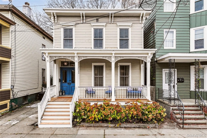 Italianate house featuring a porch