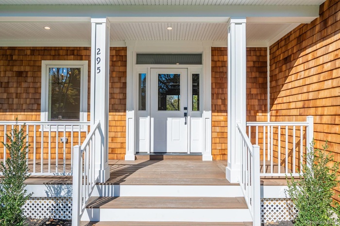 Entrance to property featuring a porch