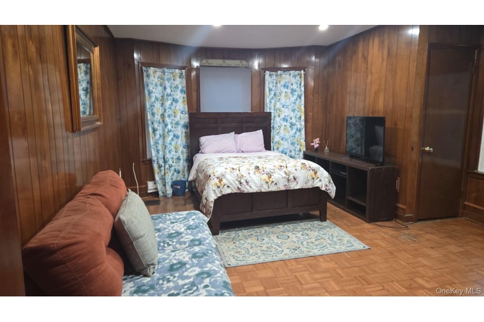 Bedroom featuring parquet floors and recessed lighting