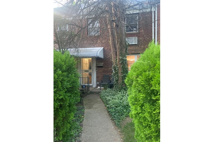 View of exterior entry with brick siding