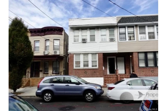 View of front of property featuring brick siding