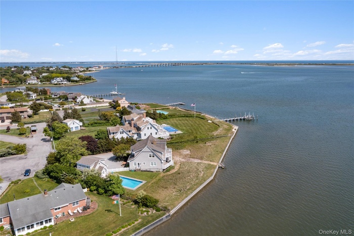 Aerial view of property's location featuring a large body of water