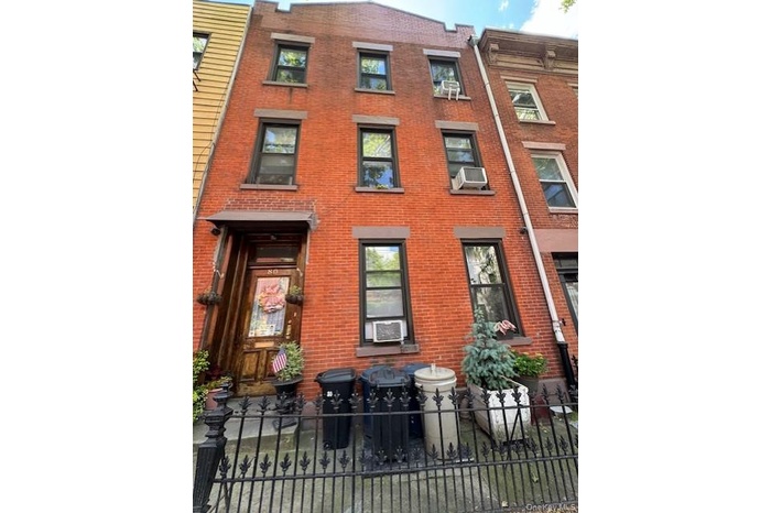 View of property with a fenced front yard