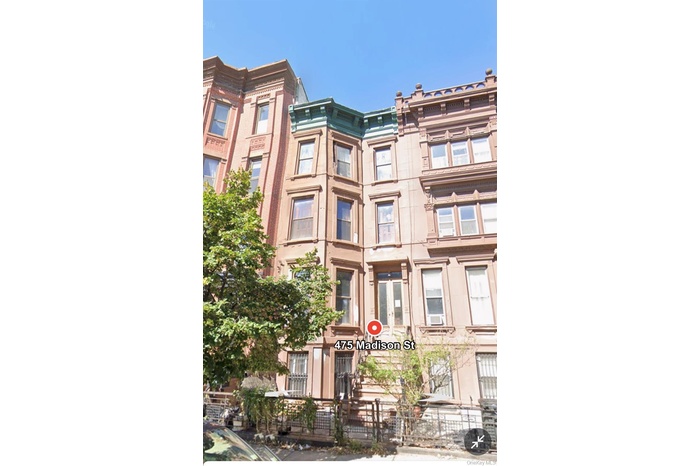 View of property with a fenced front yard