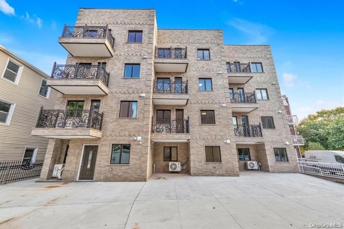 View of building exterior with fence