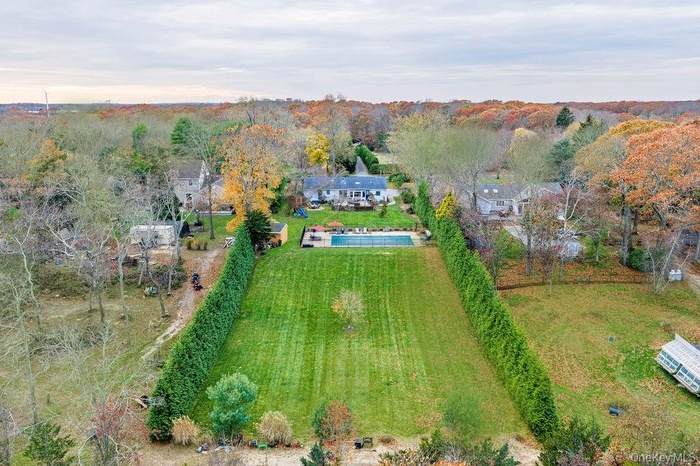 View from above of property featuring a forest