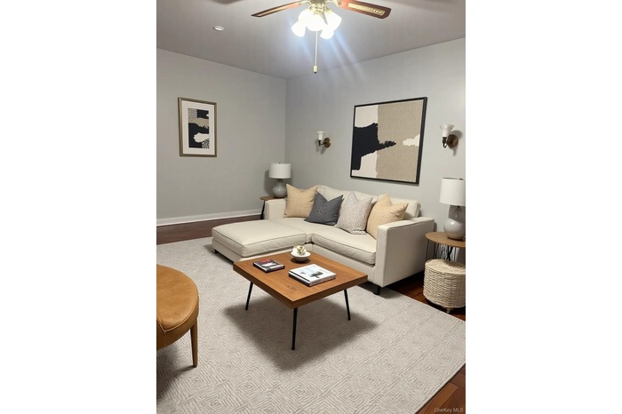 Living area with wood finished floors, a ceiling fan, and recessed lighting