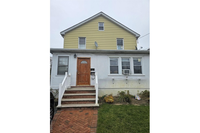 View of front facade with cooling unit