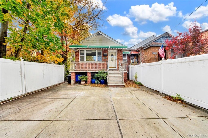 Back of property with brick siding