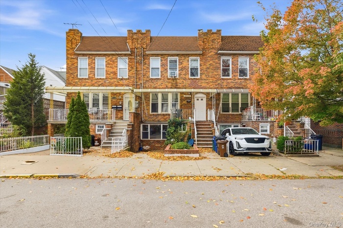 Traditional home featuring brick siding and a chimney