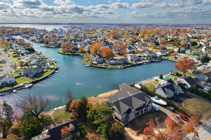 Aerial view of residential area with a nearby body of water