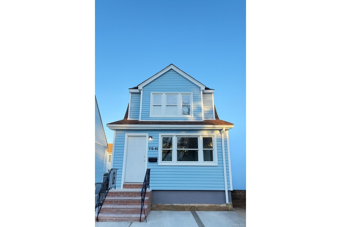 View of front of property featuring roof with shingles