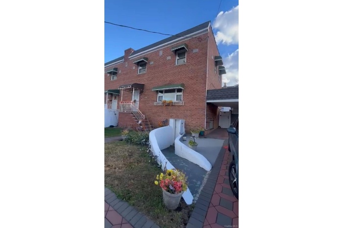 View of home's exterior featuring brick siding
