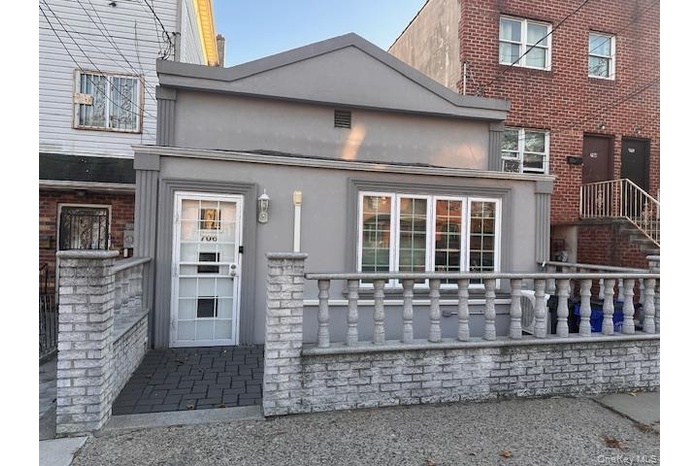 Property entrance featuring stucco siding