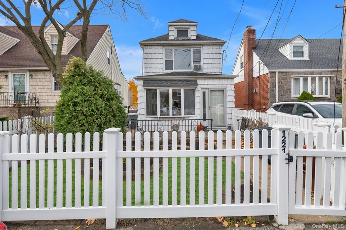 View of front of home with a fenced front yard