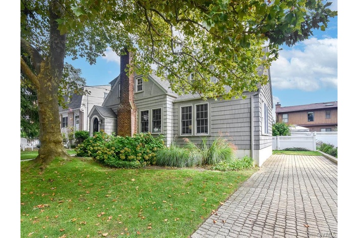 View of front of property with a chimney
