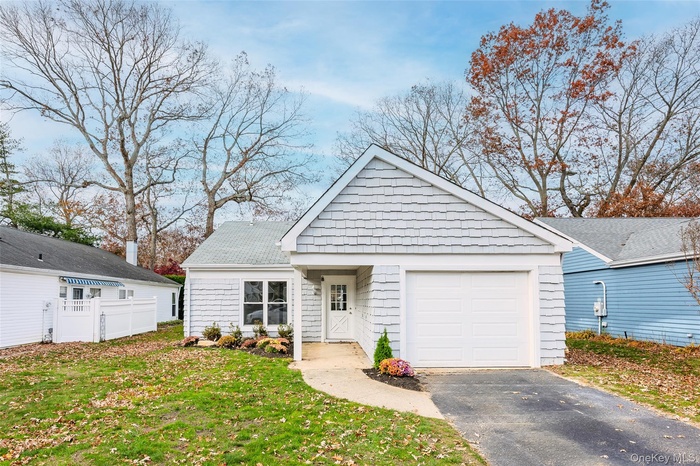 View of front of home featuring a garage and driveway