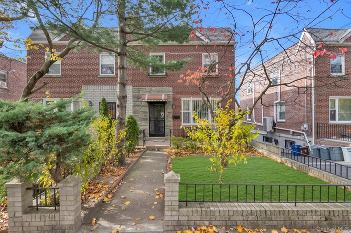 View of front of property with brick siding