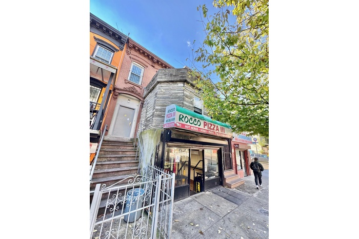 View of building exterior featuring entry steps