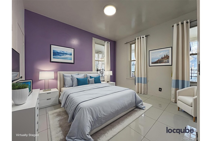 Bedroom with light tile patterned floors