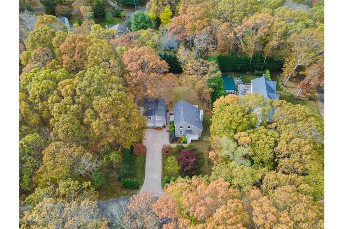 View of property location featuring a heavily wooded area