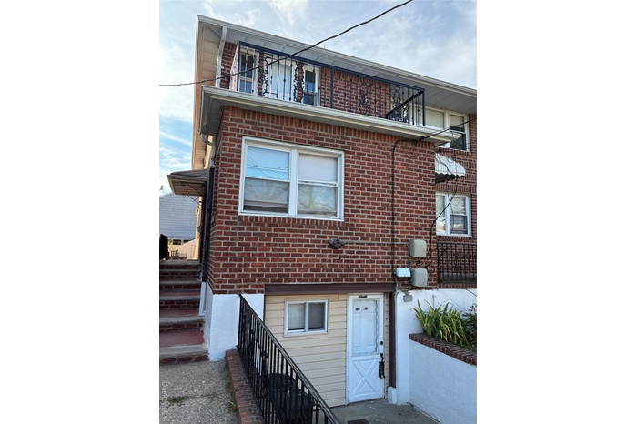 View of front facade featuring brick siding