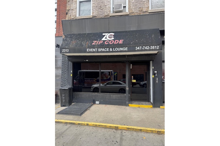 View of property with an AC wall unit